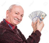 120342554-business-and-finances-concept-senior-man-holding-a-stack-of-money-portrait-of-an-exc...jpg