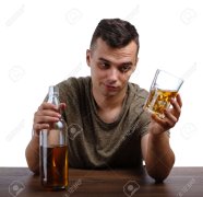 85254856-a-young-drunk-man-isolated-on-a-white-background-an-alcoholic-with-a-bottle-of-whiske...jpg