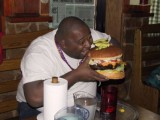 fat_20guy_20eating_20giant_20hamburger.jpg