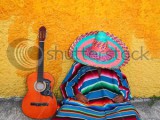 stock-photo-mexican-typical-lazy-man-sombrero-hat-guitar-serape-nap-siesta-74060005.jpg