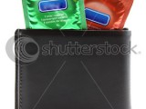 stock-photo-condoms-in-black-wallet-74021254.jpg