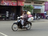 Man-with-bags-on-motor-bike.jpg