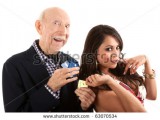 stock-photo-rich-elderly-man-with-hispanic-gold-digger-companion-or-wife-63070534.jpg