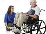 14898779-A-teen-volunteer-and-old-man-in-a-wheelchair-talking-and-laughing-together-On-a-white-backg