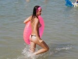 Topless-teen-with-her-balloon-in-warm-ocean-water-caught-by-a-curious-voyeur-nudist-youth-nude-girls