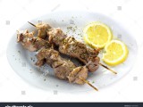 stock-photo-a-plate-with-original-greek-souvlaki-also-known-as-kalamaki-and-lemons-isolated-on-white