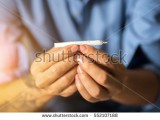 stock-photo-he-hand-rolled-marijuana-closeup-552107188.jpg