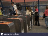 a-man-jumping-over-a-ticket-barrier-to-enter-the-warsaw-metro-B73D4P.jpg