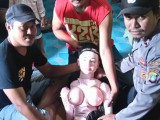 Policemen-posing-with-a-sex-doll-in-Banggai-in-Sulawesi.jpg