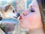 Woman kissing dog.jpg