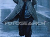 businessman-running-rain_~AA026531.jpg