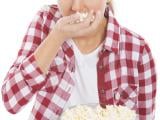 young-casual-woman-eating-popcorn-isolated-white-35441225.jpg