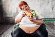 fat-woman-sits-chair-eats-1428681.jpg