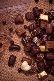 stock-photo-assorted-chocolates-on-wooden-background.jpeg.jpg